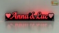 Preview: LED Namensschild Duo Gravur "Anna & Luc" + Herzen oder 2 Doppel-Wunschnamen Paar als Konturschnitt - Truckerschild Leuchtschild