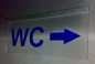 Preview: LED WC-Schild schmal  "WC + Pfeil n. rechts (oder auf Wunsch n. links)" (Klosett Örtchen Toilette) Toilettenschild Hinweisschild Wegweiser Leuchtschild